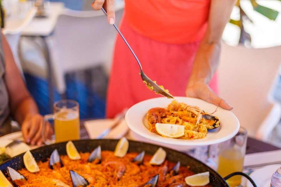 From Valencia: Albufera Private Tour, Paella & Boat Ride - Paella with Albufera Lake in the background