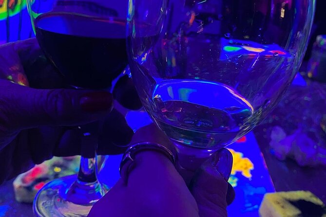 Paint a neon fluorescent picture while drinking unlimited wine - A two-hour art night with a neon twist