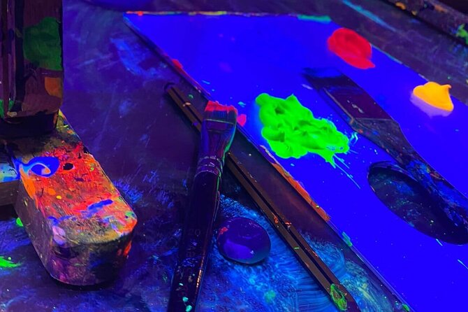 Paint a neon fluorescent picture while drinking unlimited wine - A good fit for couples, groups, and solo painters