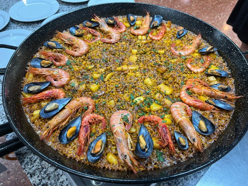 Real Paella Cooking Class – Market Visit & Sangría Workshop - Sitting down to eat the Valencian way