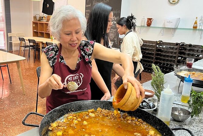 Seafood paella cooking class, tapas and visit to Ruzafa market. - Cooking Seafood Paella as a Team
