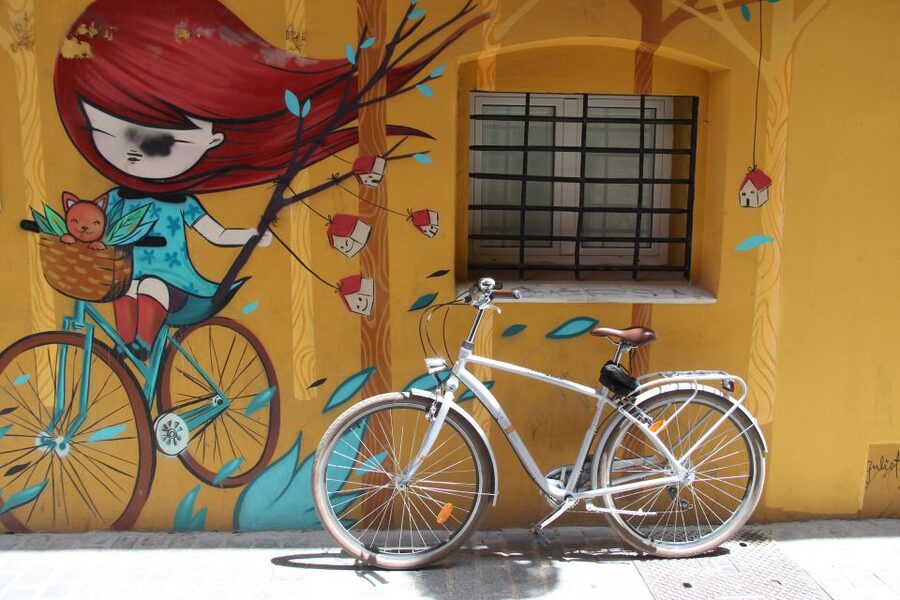 Valencia: Street Art Tour on Bicycle, E-Bike or E-Step - Riding through narrow lanes and sunny squares