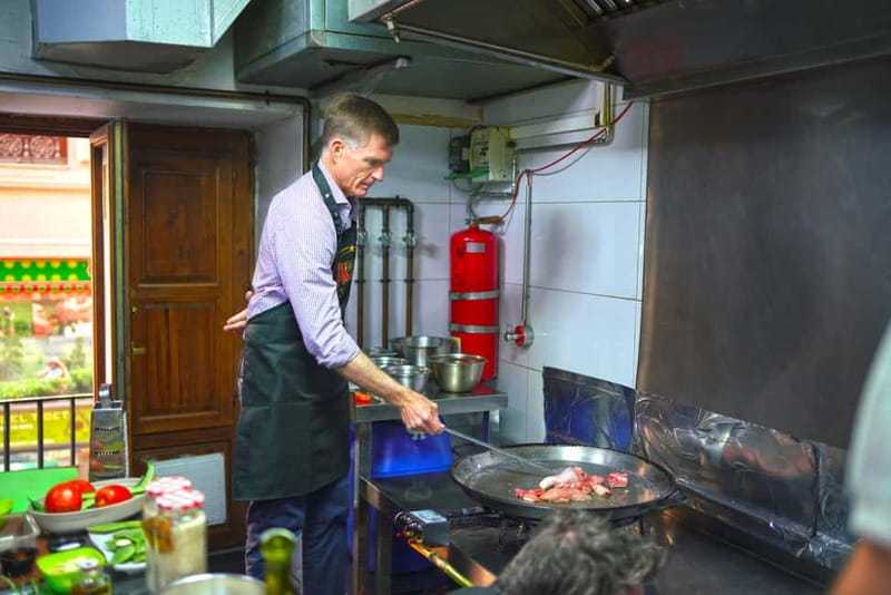Valencia: Traditional Paella Cooking Class and Dinner - Sitting down for the paella dinner