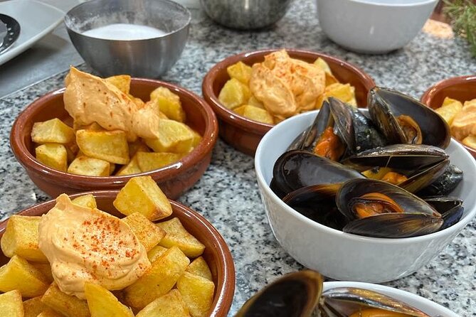 Valencian paella cooking class, tapas and visit to Ruzafa market. - Timing, price, and booking advice
